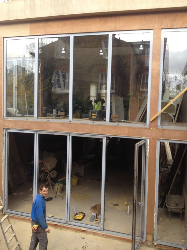 Aluminium bi-fold doors with two-storey glazing in Earl's Court