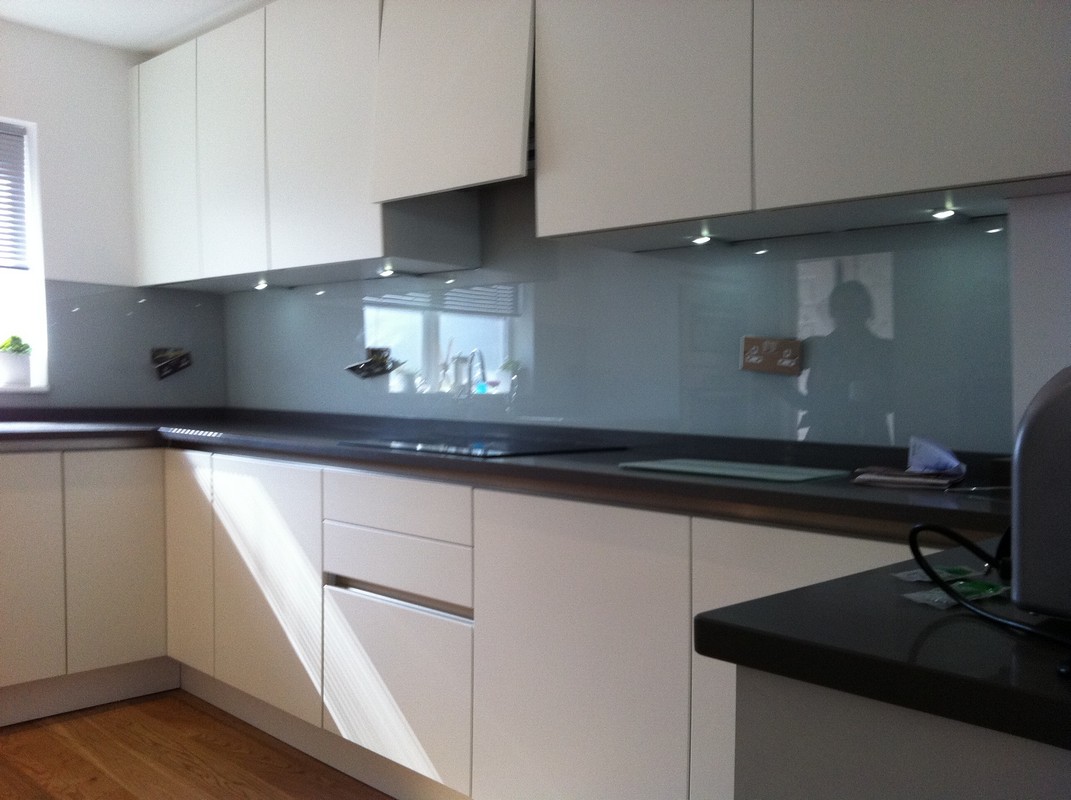 Grey glass kitchen splashback with LED lighting in Earl's Court